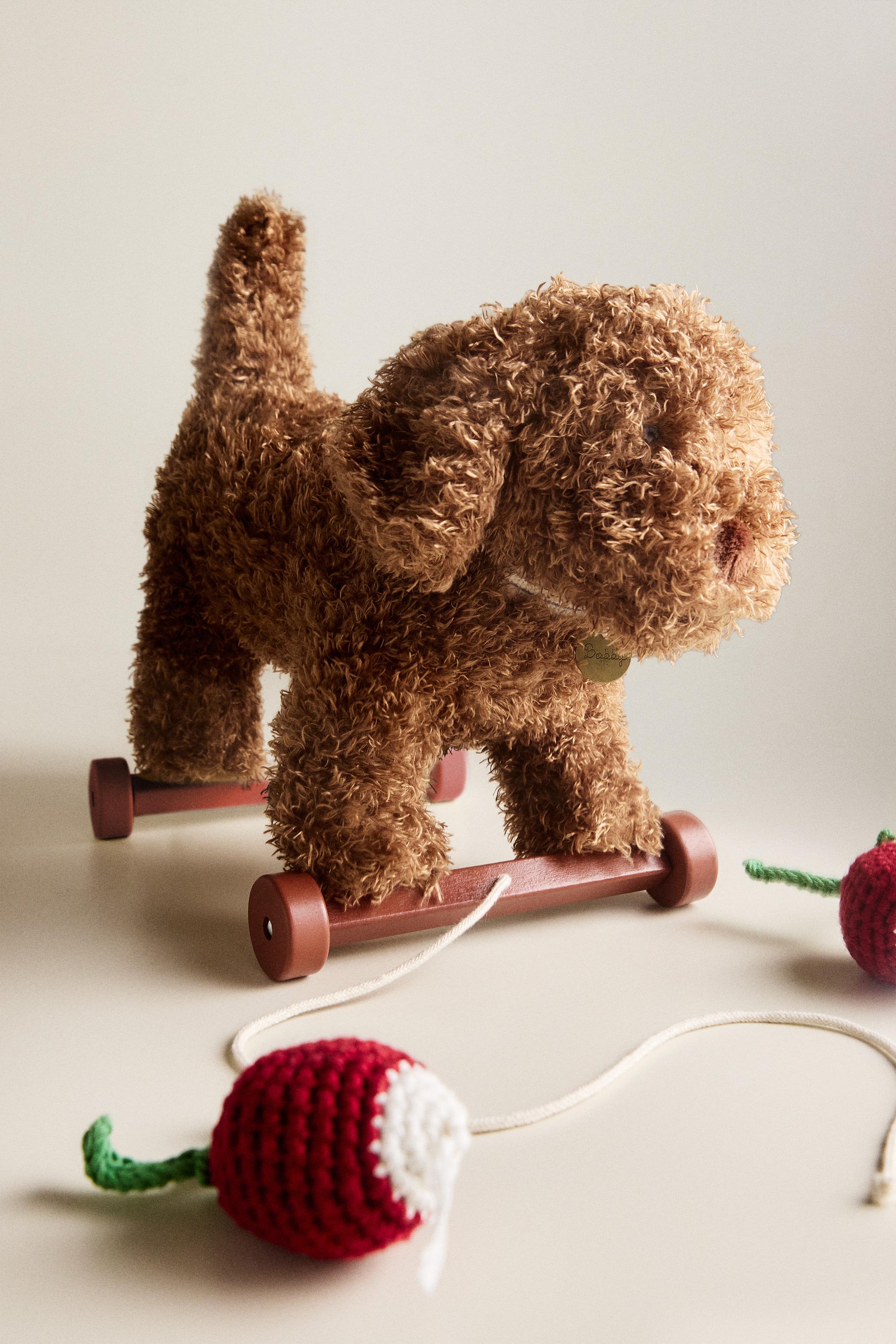 PELUCHE ENFANT CHIEN À ROUES